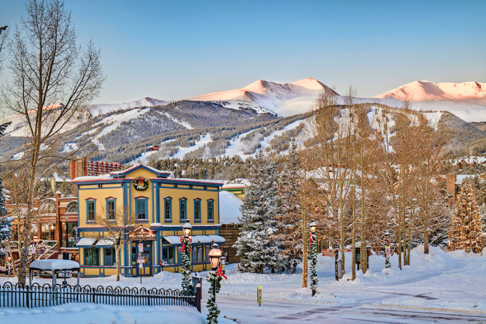 Blue River Plaza and the Breckenridge Welcome Center in the winter with ski area in the background