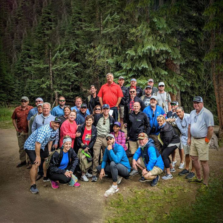 group of Beaver Run employees posing in the woods