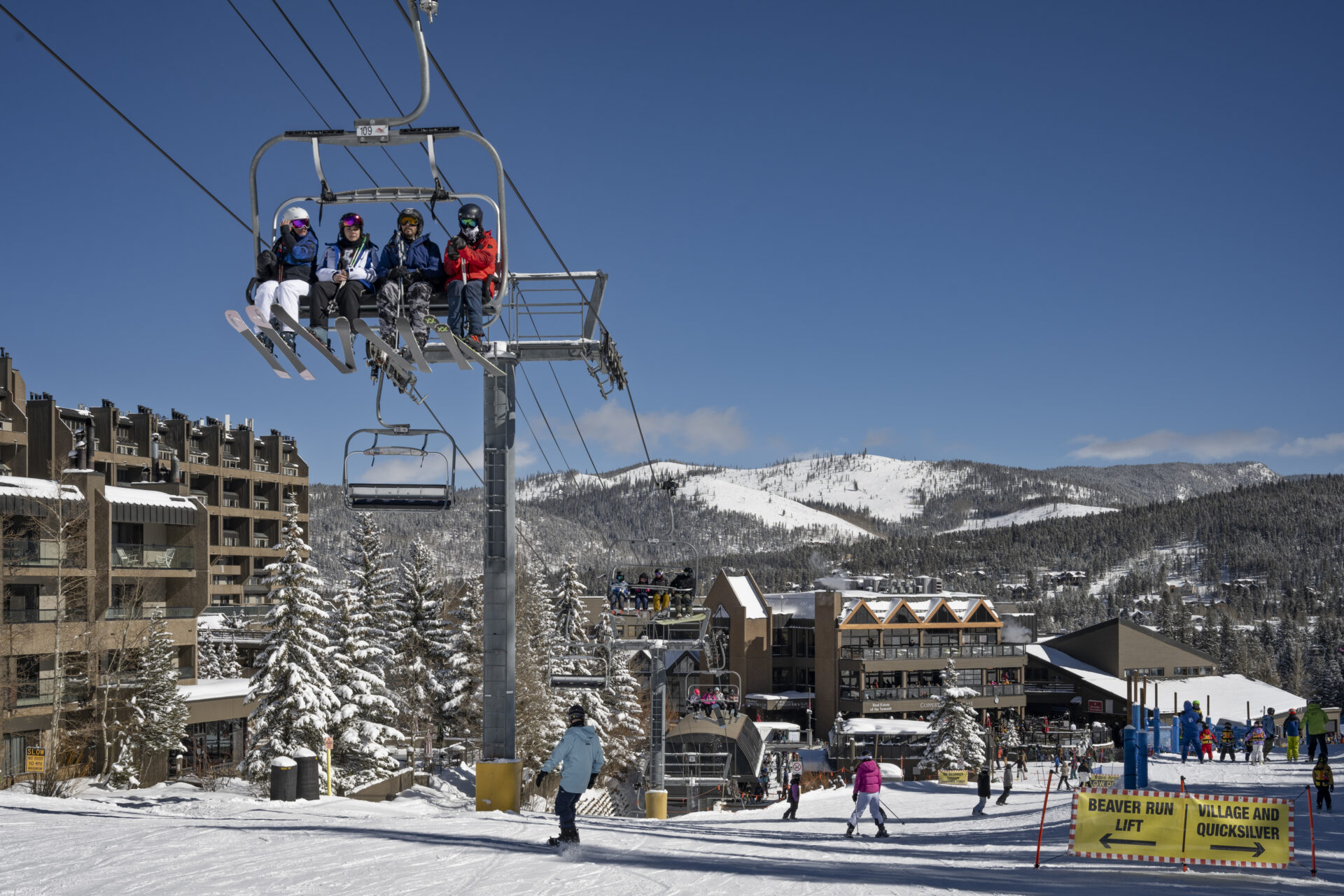 Skiers skiing and riding the Beaver Run SuperChair by Beaver Run