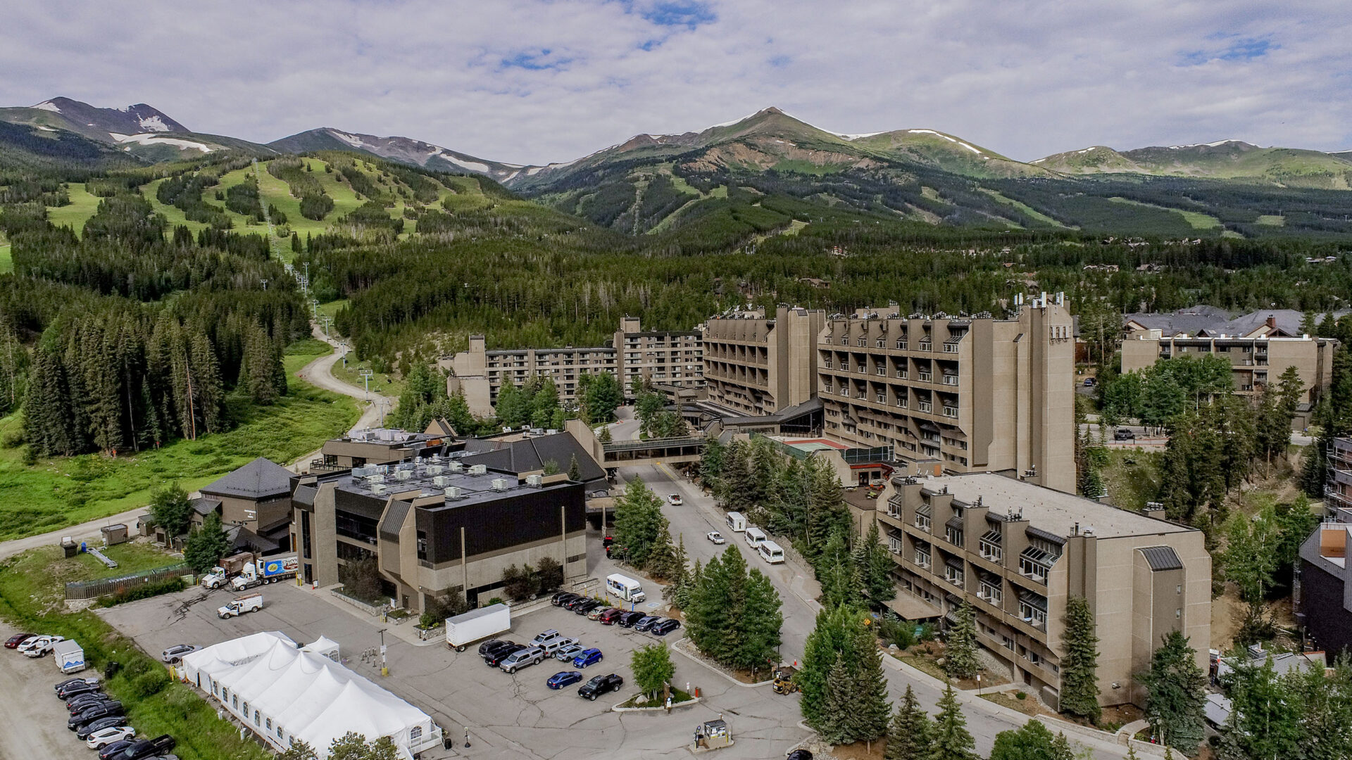 beaver run summer exterior drone shot with mountains in the background