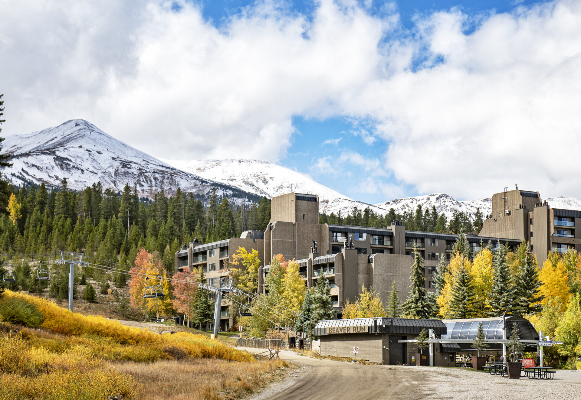 Beaver Run Building 4 fall exterior shot with snow on mountain tops