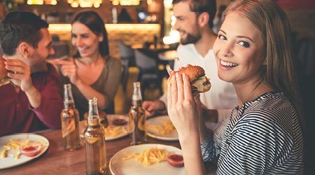 girl eating a cheeseburger