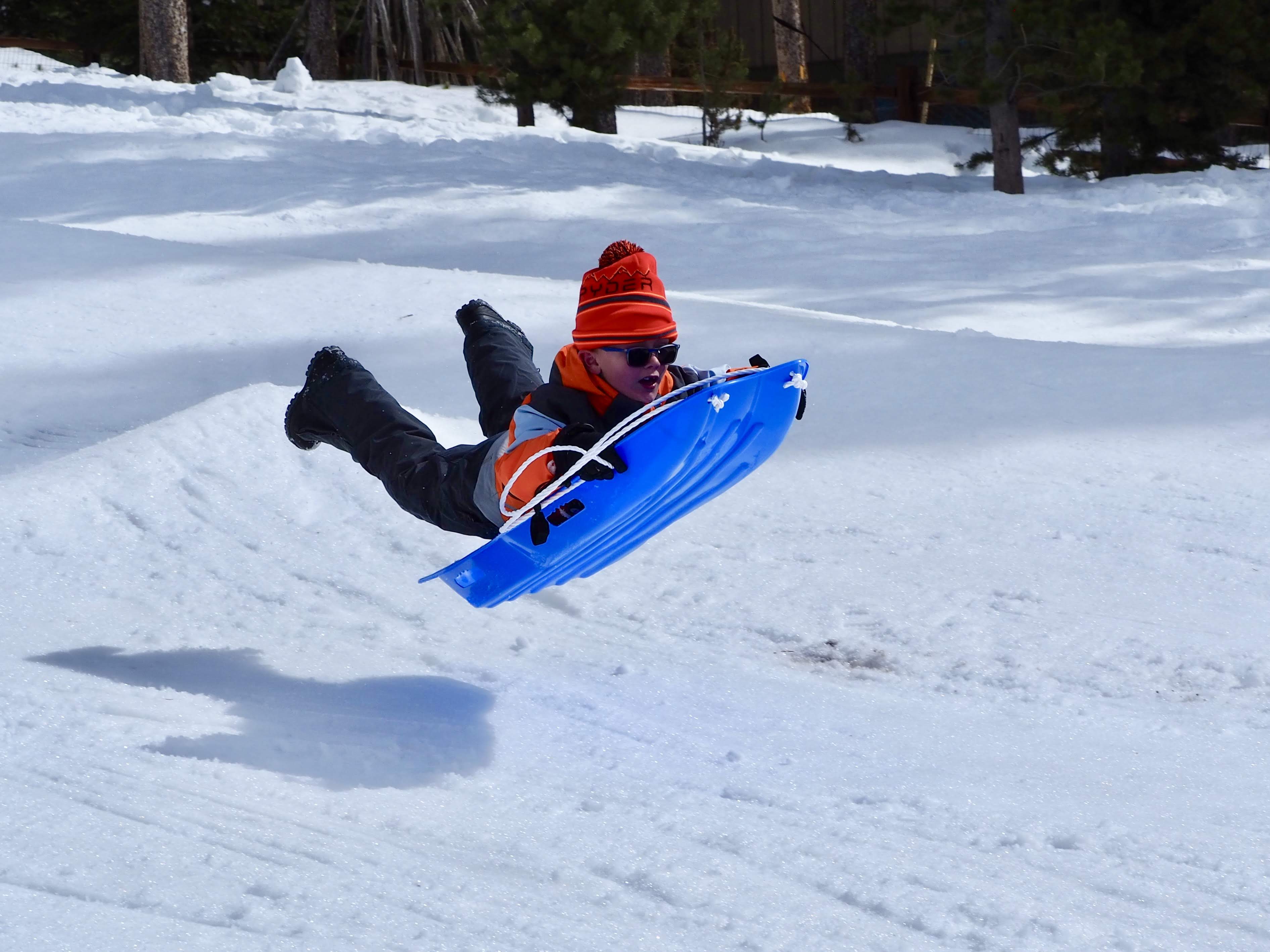 kid getting air on sled
