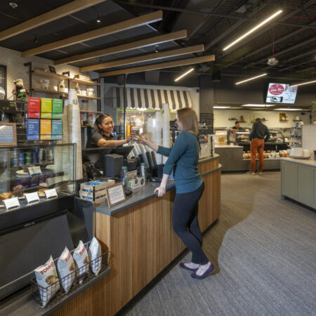 People shopping at the Starbucks counter at the Skywalk market
